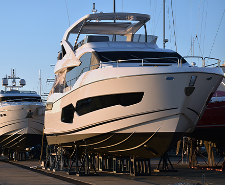 New boat on dry dock, waiting for delivery for its new owner that got the best new boat finance rates.